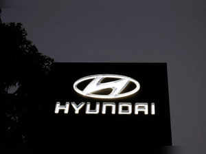 The Logo of Hyundai Motor India Limited is seen outside a car showroom, in Ahmedabad