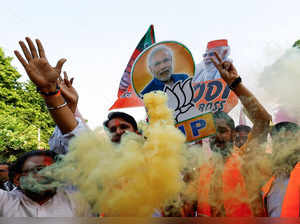 Bharatiya Janata Party (BJP) supporters celebrate outside the BJP headquarters, as the BJP leads in the election results in the northern state of Haryana, in New Delhi