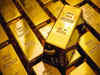 Gold eases as dollar strengthens; traders eye Fed cues