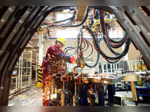 FILE PHOTO: Employee works on the production line at a factory of Chinese automaker JAC Motors in Weifang