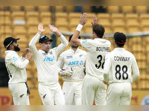 Tim Southee, second right, celebrates with teammates after the dismissal of Rohit Sharma