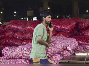 Jalandhar: An onion vendor at a wholesale vegetable market, in Jalandhar. (PTI P...