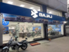 Bajaj Auto wheels in caution, drags festive mood, its stock & peers