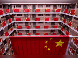 Chinese national flags hang at a public housing estate to celebrate the 75th anniversary of China's National Day in Hong Kong