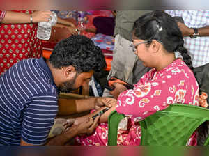 Kolkata: A doctor takes blood sample from a junior doctor at the site of a hunge...