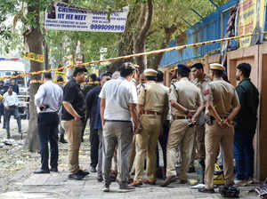 New Delhi, Oct 20 (ANI): Police personnel at the blast site near CRPF School in ...