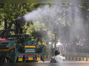 New Delhi: An anti-smog gun being used to curb air pollution, in New Delhi. (PTI...