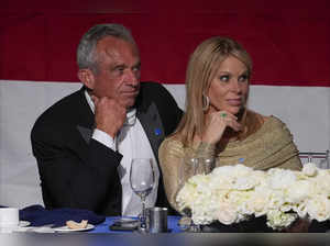 All hunky dory following the sexting scandal? RFK Jr. and Cheryl Hines show PDA at Al Smith dinner