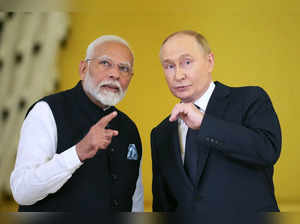 Russian President Vladimir Putin (right) and Indian Prime Minister Narendra Modi meet