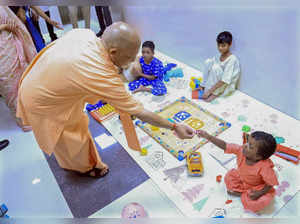 **EDS: IMAGE VIA @CMOfficeUP** Lucknow: UP CM Yogi Adityanath during a visit to ...