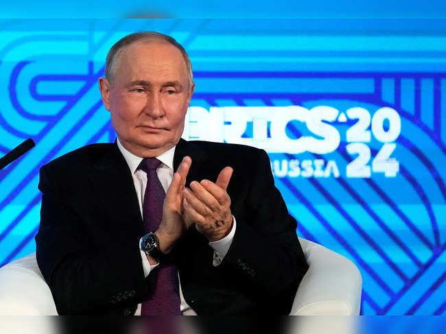 Russian President Vladimir Putin attends the BRICS Business Forum in Moscow