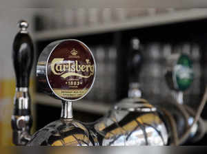 FILE PHOTO: Taps for Carlsberg beer are seen in a bar in Copenhagen