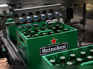 Crates of beer move along the conveyor belt at the Heineken brewery in Zoeterwoude