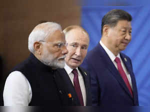 From left, Indian Prime Minister Narendra Modi, Russian President Vladimir Putin...