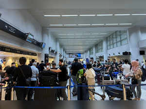 Passengers queue at the check-in counters at Beirut-Rafic Al Hariri International Airport