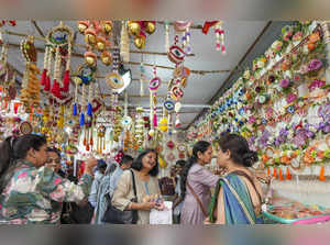 New Delhi: People shop at 'Diwali Bazaar' of the Blind Relief Association, ahead...