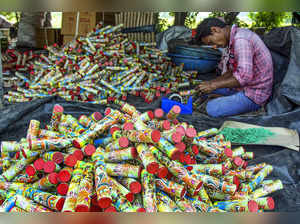 Ahmedabad: Workers pack different crackers for upcoming Diwali festival, in Ahme...