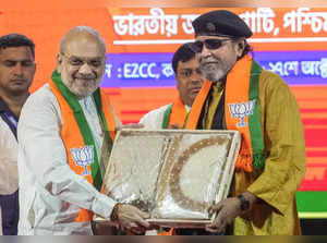 Kolkata: Union Home Minister Amit Shah with party leader Mithun Chakraborty at t...