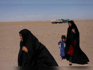 FILE PHOTO: Afghan women walk after the recent earthquake in the district of Zinda Jan, in Herat