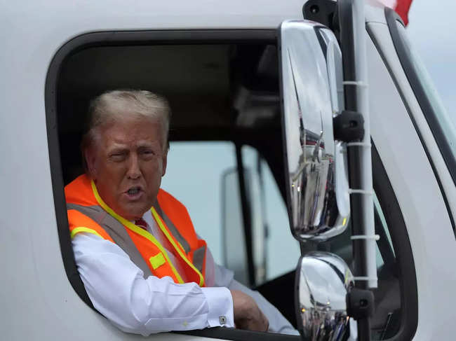 Donald Trump boards a garbage truck to draw attention to Biden remark