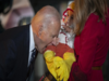 Biden bites baby dressed as chicken, sucks another's foot during Halloween celebrations. See viral pictures