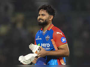 New Delhi: Delhi Capitals batter Rishabh Pant walks off the field after his dism...