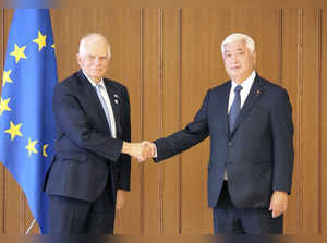 EU's foreign policy chief Josep Borrell shakes hands with Japan's Defence Minister Gen Nakatani in Tokyo