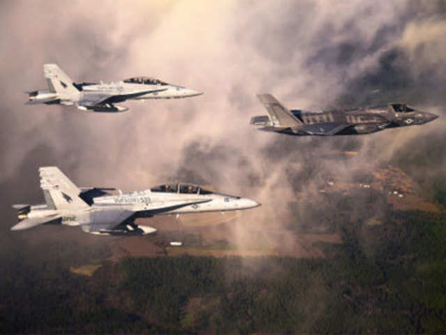 F-35 escorted by two USMC F-18 Hornets