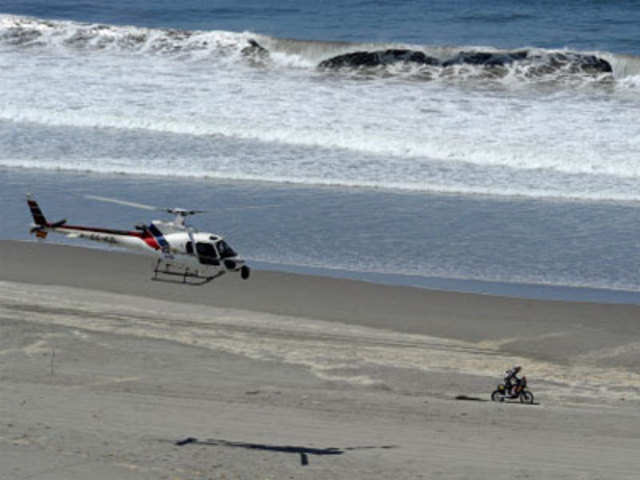 A helicopter overflies french biker Cyril Despres