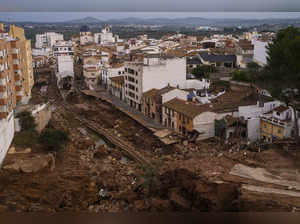 Crashing waves in a hilltop village, a night of terror from Spain's floods