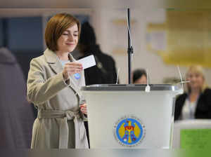 Moldova's President Maia Sandu prepares to cast her vote during a presidential e...