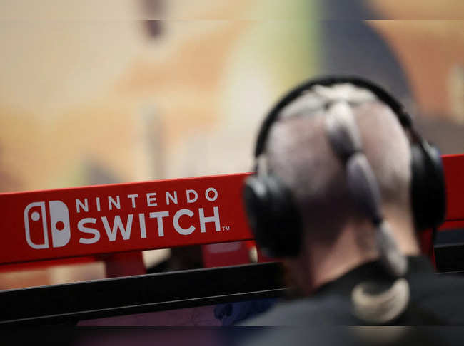 FILE PHOTO: An attendee uses a Nintendo Switch game console while playing a video game at the Paris Games Week