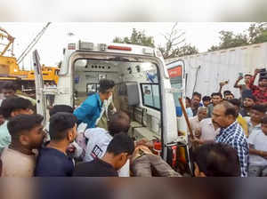 Anand: An injured labourer being taken to the hospital after a temporary structu...