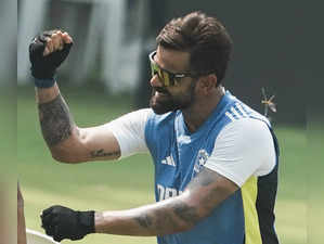 Mumbai: India's Virat Kohli gestures during a practice session as a dragonfly ho...