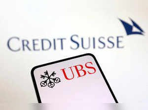 FILE PHOTO: Illustration shows UBS Group and Credit Suisse logos