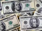 Dollar eyes weekly gain on slower Fed easing, inflation outlook