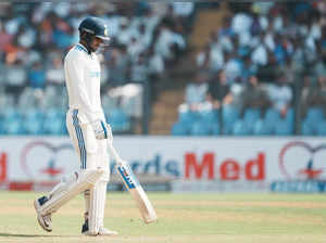 Mumbai: India's Shubman Gill walks off the field after losing his wicket during ...