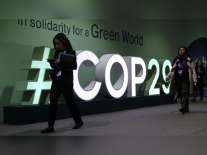 Participants walk past an installation at the United Nations climate change conference COP29 in Baku (Reuters photo)