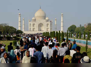 Agra: A crowd of tourists at the Taj Mahal, in Agra. A foreign female tourist vi...