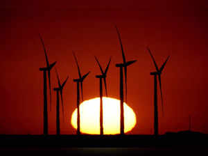 Wind turbines at the Buckeye Wind Energy are diffused by heat vapors as they are...