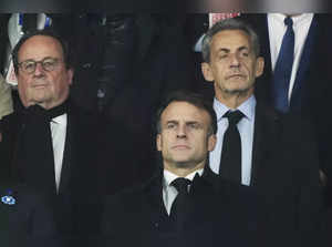 French President Emmanuel Macron, centre, and Former French Presidents Nicolas S...