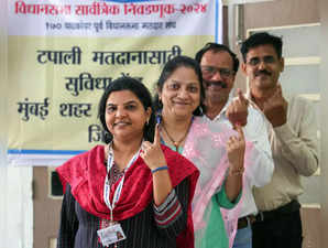 Mumbai Suburban, Nov 12 (ANI): Polling staff show their ink-marked fingers after...