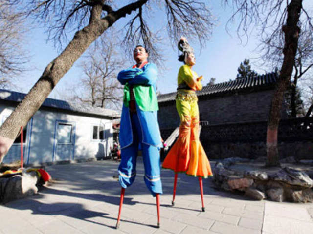 Folk artists on stilts at the Spring Festival Temple Fair