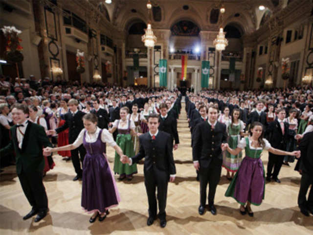 Young couples in traditional costumes in Vienna