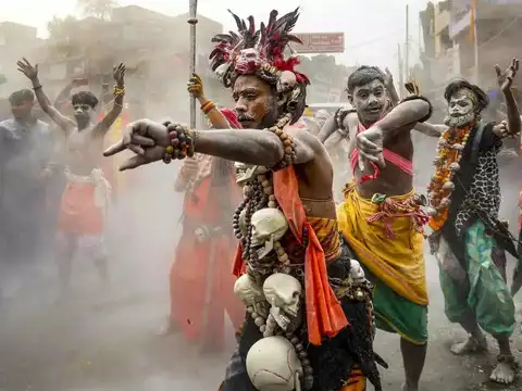 Performers illuminate the procession