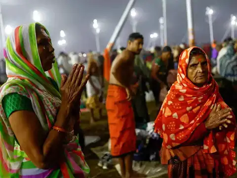 Devotees pray at Sangam