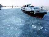 A boat is seen at a frozen lagoon in Venice