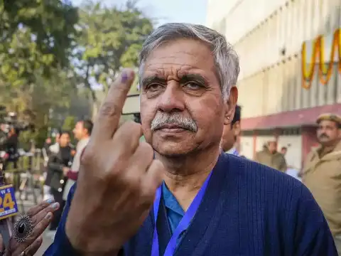 Sandeep Dikshit shows ink-marked finger