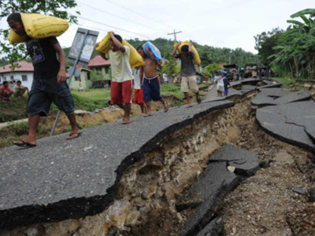 Civilian volunteers carry relief goods