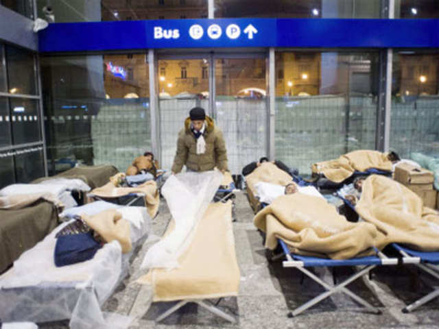 Homeless people settle into temporary beds in Turin